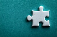 Single white jigsaw puzzle piece casting soft shadow on turquoise textured background, symbolizing solution, connection and business strategy concepts.