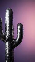 Metallic sequined cactus sculpture against purple pink gradient background for modern interior design and contemporary art projects.