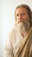 Thoughtful senior Caucasian man with long gray beard and hair wearing beige clothing against neutral background for wellness and lifestyle concepts.