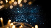 Sparkling blue glitter particles with golden bokeh lights creating magical festive atmosphere for holiday celebrations and luxury event backgrounds.
