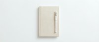 Closed beige linen notebook with metal pen attached to spine on white background, suitable for stationery, office supplies, and business branding mockups.