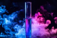 Glass test tube with glowing blue liquid surrounded by vibrant pink and blue smoke effects against dark background, creating mystical laboratory atmosphere.