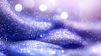 Abstract purple and blue cosmic background with glittering particles and bokeh light effects creating dreamy atmospheric texture for digital design projects.