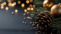 Festive Christmas decoration with golden ornament and pine cone on dark background with warm bokeh lights creating cozy holiday atmosphere for seasonal designs.