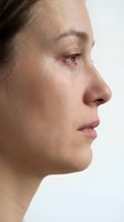 Young woman profile with natural skin texture and minimal makeup showing authentic beauty and skincare concept for wellness campaigns.