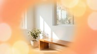Wooden bench with potted plant near window, warm sunlight streaming through glass, soft blurred bokeh background in orange and yellow tones, minimalist interior design setting.