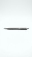 Sleek metallic ballpoint pen with polished chrome finish isolated on white background, ready for product design and marketing use.
