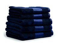 Stack of folded navy blue cotton bath towels with decorative stripe pattern on white background, isolated luxury bathroom textile for hotel and spa amenities.