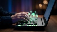 Businessman hands typing on laptop with glowing green house icons representing digital real estate technology and property investment solutions.