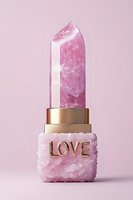 Pink rose quartz crystal lipstick with gold base and love text on pink crystal holder against soft pink background, modern luxury cosmetic concept.