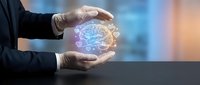 Businessman hands protecting glowing brain with neural network connections representing artificial intelligence and mental health care innovation.
