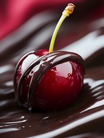 Fresh ripe cherry covered with dark melted chocolate drizzle on brown background, macro food photography for dessert and confectionery advertising.