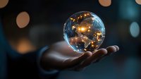 Crystal ball floating over palm shows glowing city lights and reflections against dark background with bokeh effects, concept of future prediction and magic.