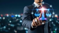Professional businessman touching digital justice scales with network connections representing legal technology and corporate law services.