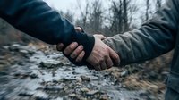 Two men in tactical gear shaking hands outdoors in winter forest setting symbolizing partnership, teamwork, cooperation and military alliance agreement.