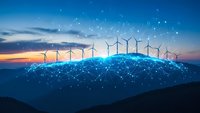 Wind turbines on illuminated digital hill at sunset with network connections representing sustainable energy technology and smart grid innovation.
