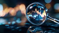 Financial market analysis through magnifying glass showing stock chart data with city skyline reflection on dark background with bokeh lights.