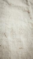 Natural linen fabric texture with organic fibers and rustic weave pattern for textile design and craft projects.