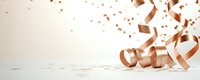 Elegant rose gold metallic ribbons and confetti falling on light background with copy space, festive celebration concept for party decoration.