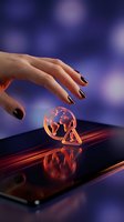 Hand with dark metallic nail polish hovering over smartphone displaying glowing warning icon and globe symbol against blurred purple background for cybersecurity and digital risk concepts.