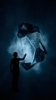Silhouetted figure interacting with glowing geometric crystal structure in dark starry atmosphere, conveying innovation, technology, and digital transformation concepts for corporate and futuristic design.