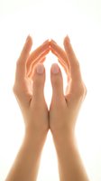 Female hands forming protective shelter gesture on white background symbolizing care, safety and security concepts for healthcare and insurance.