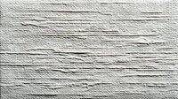White textured wall surface with horizontal linear patterns and rough plaster finish for interior design and architectural backgrounds.