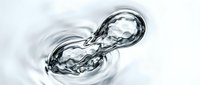 Splashing water droplet frozen in motion against white background, suitable for beverage, cosmetics, and wellness product marketing.