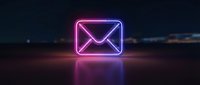 Glowing neon email icon with pink and blue gradient light effects on dark surface, digital communication concept for web design and marketing materials.