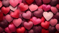 Glittering red and pink heart shapes with sparkly texture create romantic pattern background, perfect for Valentine's Day designs and love-themed projects.