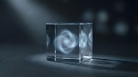 Transparent glass cube with swirling white energy vortex inside, isolated on dark background for design, overlay, and digital art projects.