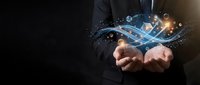 Businessman in dark suit holding glowing digital tablet with data streams and light effects, representing technology, innovation, and digital transformation for business solutions.