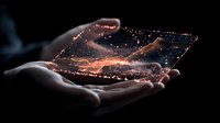Magical glowing orange hologram floating above open palms in dark atmosphere, with sparkles and light particles creating futuristic technological effect.
