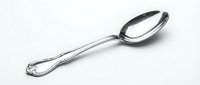 Silver metal tablespoon with ornate decorative handle isolated on white background for kitchen utensil and dining cutlery design projects.