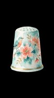 Watercolor sewing thimble with delicate bird and coral floral design, isolated on transparent background. Ready for clipart, sublimation, print-on-demand products, t-shirt designs, stickers, and craft projects.