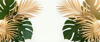 Tropical golden palm leaves and monstera foliage frame on cream background for summer design projects and botanical decorations.