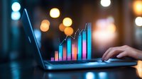 Glowing financial chart with rising bars in blue and purple colors projected from laptop screen against blurred bokeh background, business analytics concept.