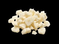 Pile of diced white cheese cubes isolated on transparent background, ready for culinary design, food packaging, recipe graphics, cooking blogs, restaurant menus, and print-on-demand products.
