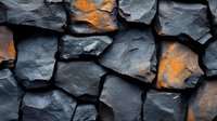 Dramatic stone wall texture with rough gray rocks and orange lichen patches creating natural contrast. Abstract architectural background pattern.