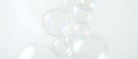 Floating soap bubbles with soft iridescent reflections on white background, isolated and ready for design overlays, presentations, and digital compositions.