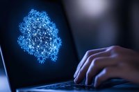 Digital visualization of glowing blue virus molecule on laptop screen while person types on keyboard in dark environment. Medical research concept.
