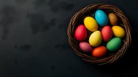 Colorful Easter eggs in wicker basket on dark background for spring holiday celebration and festive decoration projects.