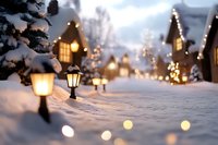 Cozy winter evening scene with glowing street lamps illuminating snow-covered path, festive lights and houses creating magical holiday atmosphere in background.
