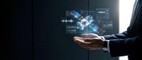 Businessman hand presenting holographic digital technology interface with glowing data visualization and futuristic network connections in dark office.