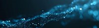 Abstract network of glowing blue particles with bokeh effect creating wave-like formation against dark background, digital connectivity concept.