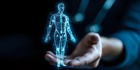 Glowing blue hologram of human anatomy floating above hands in dark background, representing future medical technology and artificial intelligence innovation.
