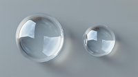 Transparent glass spheres casting soft shadows on gray background, realistic water drops or crystal balls with light reflections and refractions for luxury design.