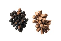Dark and milk chocolate curls and shavings arranged in decorative clusters on white background, isolated for confectionery and baking designs.