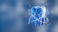 Digital tooth with atomic structure rings and particles on blue background for dental technology and healthcare innovation concepts.