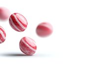 Striped peppermint candy balls floating on white background with soft shadows, red and white swirled pattern creates dynamic composition for food design.